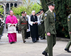 Archbishop Michael Jackson passes the guard of honour before taking part in the 1916 Commemoration Ceremony at the graveside of the leaders of the Easter Rising in Arbour Hill.
