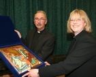 The Revd Ruth Elmes receives the gift of an Icon from the parishioners of St Brigid's Church, Stillorgan after her ordination in the Church. Also pictured is the Rector of St Brigid's Stillorgan and All Saint's Blackrock, the Revd Ian Gallagher. 