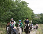 Returning on Horseback at the annual Donard and Dunlavin Parish Ride out and BBQ hosted in Moat Farm in Donard.