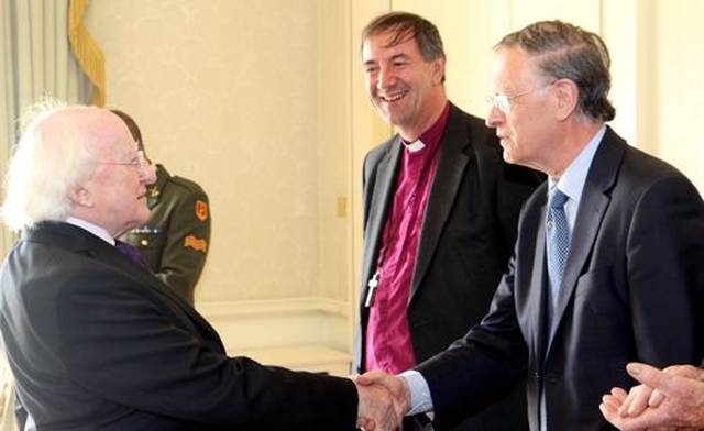 President Michael D Higgins greets Dáithí Ó Maolchoille, treasurer of Cumann Gaelach na hEaglaise during the organisation’s visit to Áras an Uachtaráin to mark its centenary. Also pictured is the Cumann’s chairperson, Bishop Michael Burrows. 