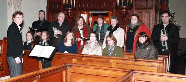 Siobhan Kilkelly, conductor, pictured with members of the Sandford and Milltown choirs at the Carol Service in Sandford Church. Photo: David Wynne.