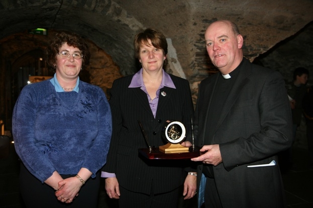 Pictured receiving a presentation from Barbara Davis, Hon Secretary of Powerscourt Select Vestry (centre) and Georgina Masterson, Hon Secretary of Kilbride Select Vestry (left) is the newly installed Archdeacon of Glendalough, the Venerable Ricky Rountree.