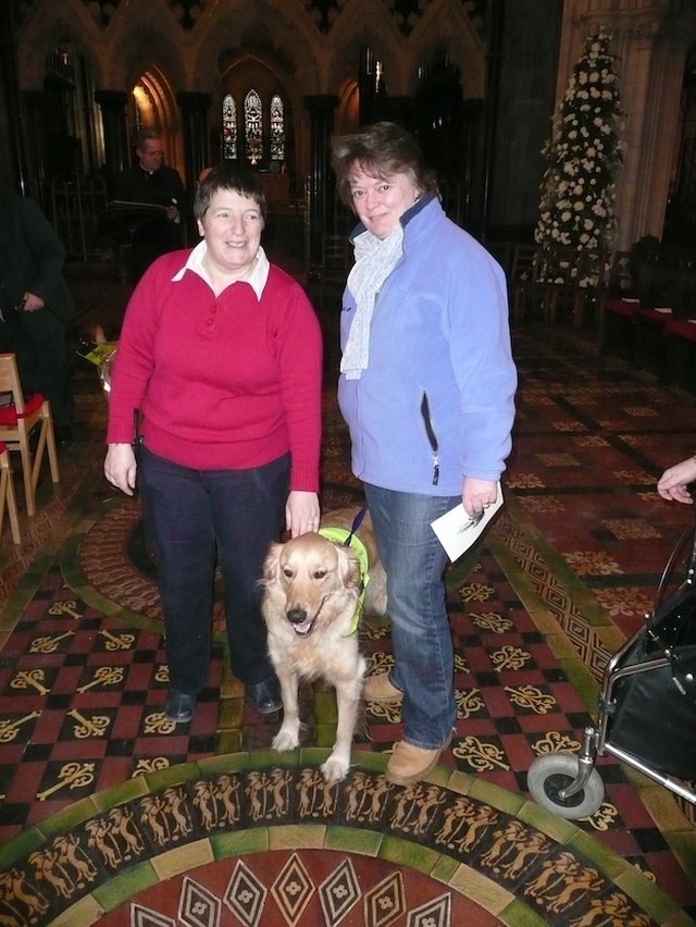Lesley Rue, Anne Taylor and their canine friend Alfie pictured at the Peata Carol Service in Christ Church Cathedral.