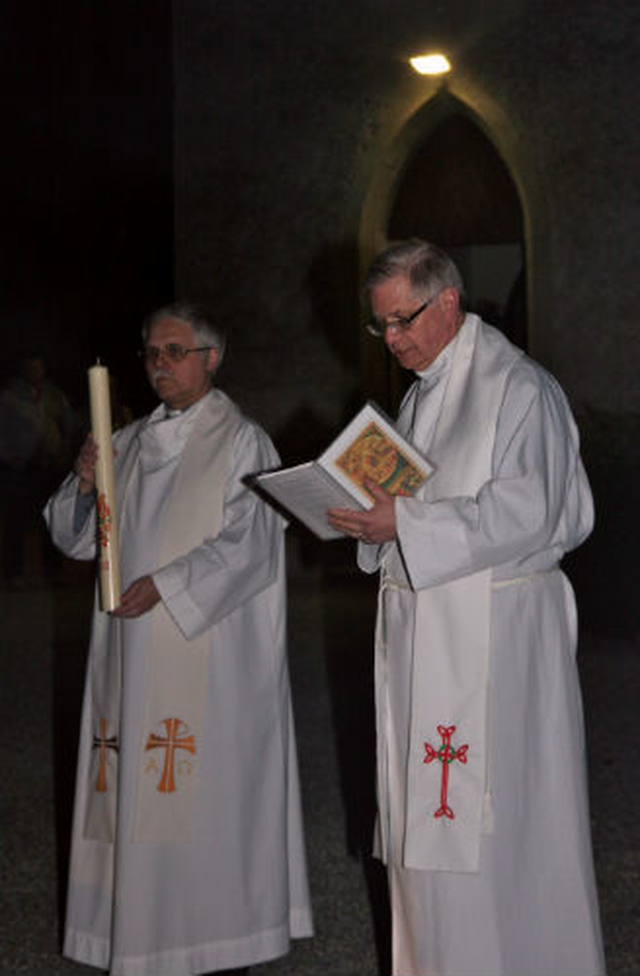 Associate vicar of Wicklow and Killiskey, Revd Ken Rue and rector of Wicklow and Killiskey, Canon John Clarke, prepare to light the Easter Candle at the Easter Vigil at Killiskey Church. 