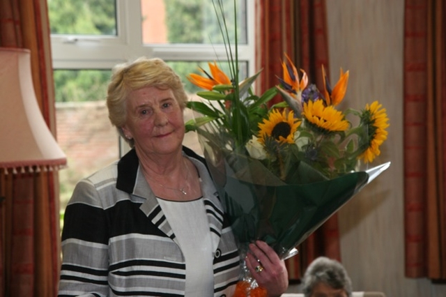 Tess Breach, with flowers presented to her at a retirement party in her honour after she retired after 19 years service in St Mary's home, Pembroke Park.