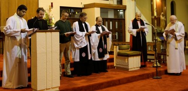 Fr Binoy Matthew, the Rev Ivor Owen, the Revd Michael Anderson, Canon Nigel Sherwood, Canon George Butler, Archbishop Michael Jackson and Canon John Piert deliver the blessing at the end of the service in St Joseph’s Church, Templerainey, Arklow at which the Archbishop preached to mark the Week of Prayer for Christian Unity.  