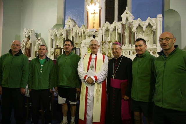 The Archbishops of Dublin, the Most Revd Dr John Neill (centre left) and the Most Revd Diarmuid Martin (centre right) with members of the St Patrick's Rowing club who brought an Icon of St Patrick up the river Liffey to the Dublin Council of Church's Ecumenical St Patrick's Eve service in City Quay RC Church.