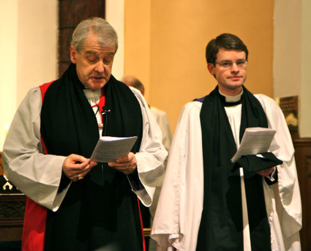 Archbishop Michael Jackson reads the Act of Institution at the Service of Institution of Revd Niall Sloane at Holy Trinity Killiney.