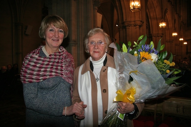Celia Dunne presenting Betty Neill with flowers at a special presentation ceremony in Christ Church Cathedral following the Eucharist to mark the retirement of Archbishop Neill. 