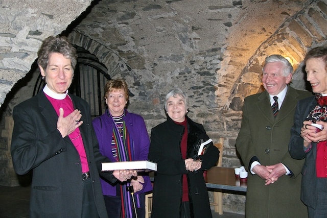 The Most Revd Dr Katherine Jefferts Schori pictured with her copy of Christ Church Cathedral Dublin: A History, as author Dr Kenneth Milne looks on. 