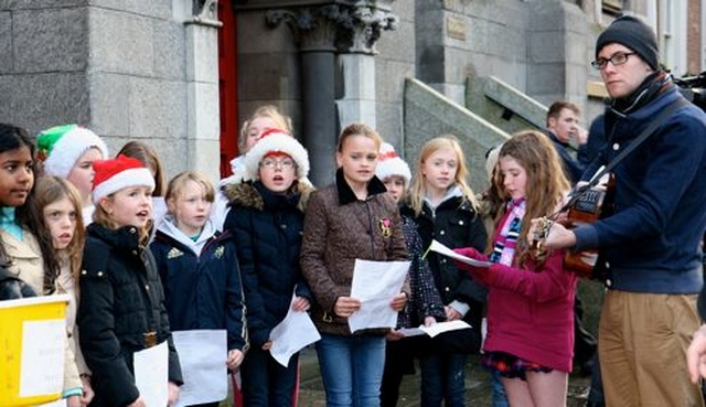 The pupils of Kildare Place School sing carols outside St Ann’s Church, Dawson Street, at the launch of the 2012 Black Santa Sit Out which raises funds for a number of charities including St Vincent de Paul, the Salvation Army, the Simon Community, Protestant Aid, Trust and the Church of Ireland Overseas Aid. The appeal continues until Christmas Eve.