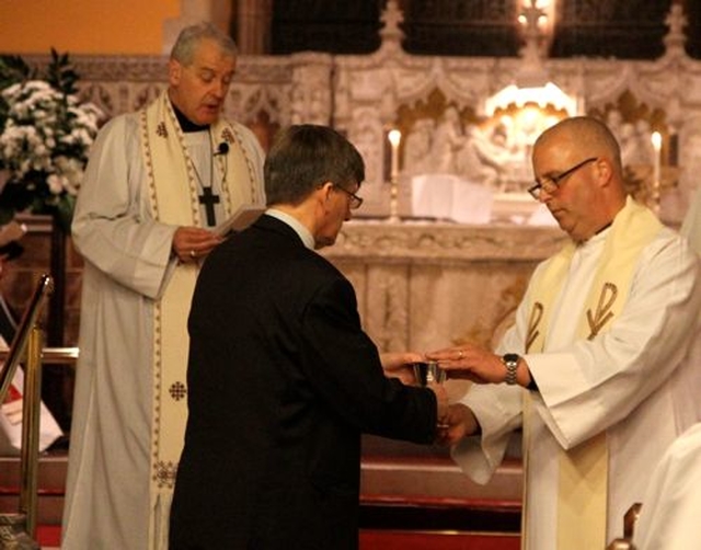 The Revd Stephen Neill receives the symbols of ministry at his institution as the new Rector of Celbridge and Straffan with Newcastle–Lyons. 