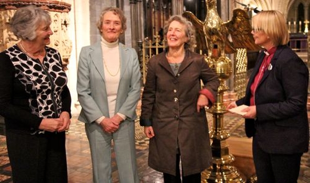 Joan Rufli, Thea Boyle and Audrey Smith were three of the first five women lay readers to be appointed by the then Archbishop Alan Buchanan alongside Daphne Wormell. They are pictured with Bishop Pat Storey in Christ Church Cathedral last night (December 10) when a cross left by Daphne for the first woman bishop was presented. 
