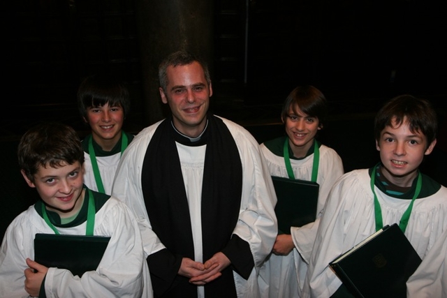 The Revd Andrew McCroskerry with choiristers that received RSCM (Royal School of Church Music) Awards in Christ Church Cathedral.