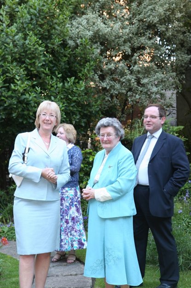 The Minister for Arts, Tourism and Sport, Mary Hanafin TD enjoying a walk in the garden of Marsh's library with librarian, Muriel McCarthy at the launch of Hippocrates Revived, an exhibition of books on anatomy and medicine in the library.