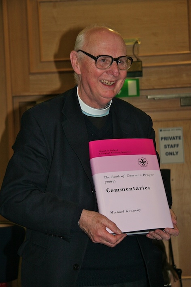 Canon Michael Kennedy pictured with a rare hard copy of his virtual resource, ‘Canon Michael Kennedy's Commentaries on the BCP 2004’, at its launch at the Church of Ireland General Synod in Armagh.