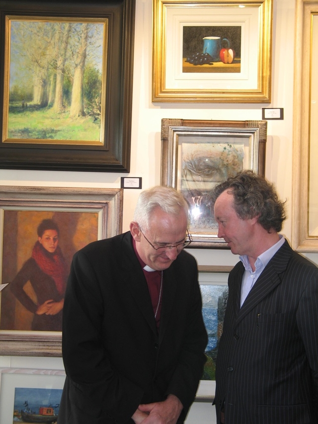 The Archbishop of Dublin lends an ear to artist, Mick O’Dea RHA at the opening of the Hermione Art Exhibition in Alexandra College.