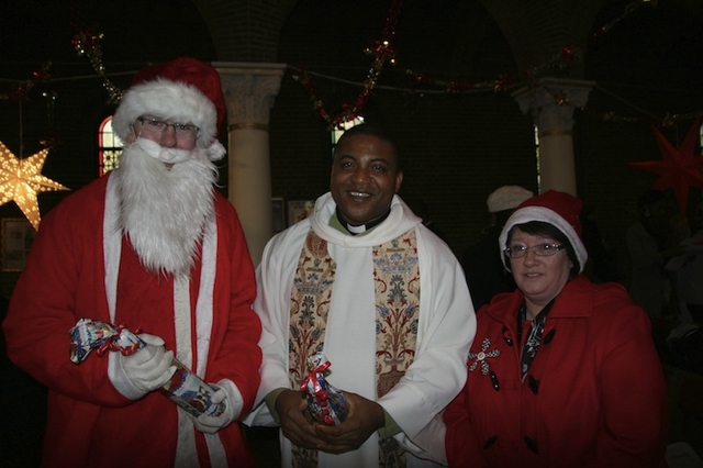 Pictured at the Multi-cultural Carol Service in St George and St Thomas's Church, Cathal Brugha Street, were special guest Santa Claus; the Revd Obinna Ulogwara, Rector; and Gillian Dean, Churchwarden. 