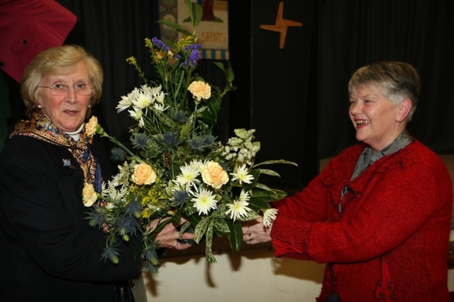 Betty Neill, wife of the Archbishop of Dublin the Most Revd Dr John Neill is presented with flowers following the reception to mark the centenary of the foundation of Stillorgan and Blackrock Mothers' Union.