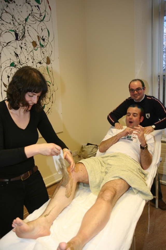 Ordinand in the Church of Ireland Theological Institute Colin McConaghie gets his legs waxed for charity (Bishop's Appeal). Offering moral support is fellow ordinand Jim Caldwell.