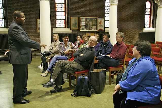 The Revd Obinna Ulogwara, Rector of St George and St Thomas' Parish, addressing the delegation from Diakonhjemmet University in Norway on their visit to the parish church.