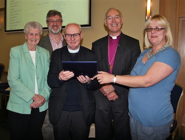 Canon Michael Kennedy pictured with members of his family and Archbishop Alan Harper at the launch of his virtual resource, ‘Canon Michael Kennedy's Commentaries on the BCP 2004’, at the Church of Ireland General Synod in Armagh.