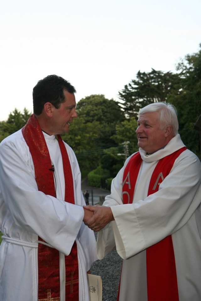 The former Rector of Greystones, the Venerable Edgar Swann (right) congratulates his successor, the Revd David Mungavin at the latter's institution.