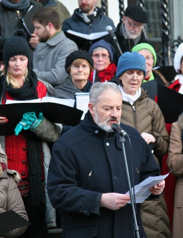 Father Kevin Doran, Secretary General International Eucharistic Congress 2012, reads a lesson at the community carol singing at the Mansion House.