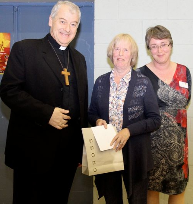 Judy Cameron was honoured at Synods in Taney Parish Centre for her commitment to the Archbishop’s Course in Theology. She is retiring from the position as voluntary honorary secretary after 19 years. She is pictured with Archbishop Michael Jackson, who made a presentation to her, and Dr Anne Lodge, principal of CICE, who led the tributes to her. 