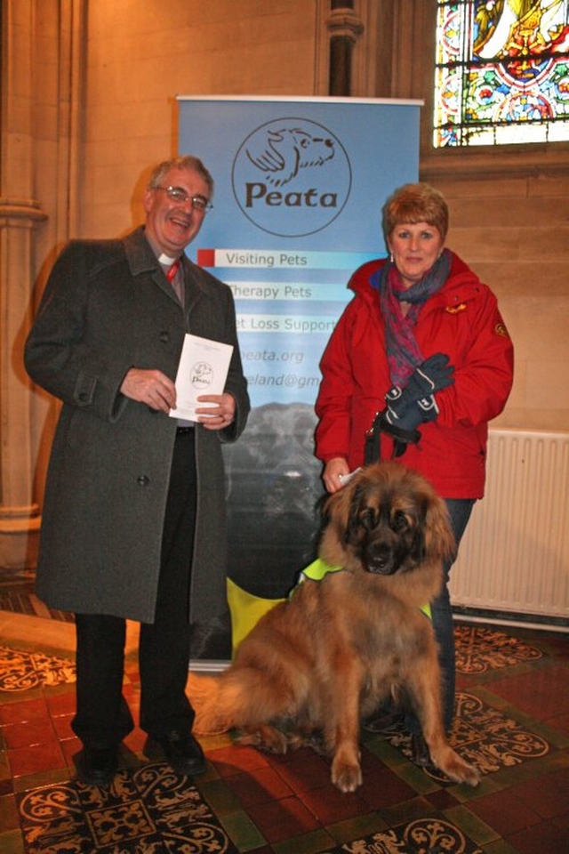 Canon Ted Ardis with Deirdre Murphy and Dexter at the Christ Church Cathedral Charity Carol Service in aid of Peata – Providing a Pet Therapy Service to caring institutions in Dublin.