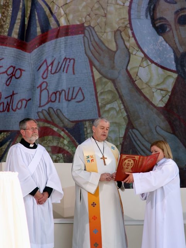 Revd Martin O’Connor, curate St Ann’s, Dawson Street and Archbishop Michael Jackson on the alter at the Liturgy of the Word and Water on the first full day of the International Eucharistic Congress in the RDS.