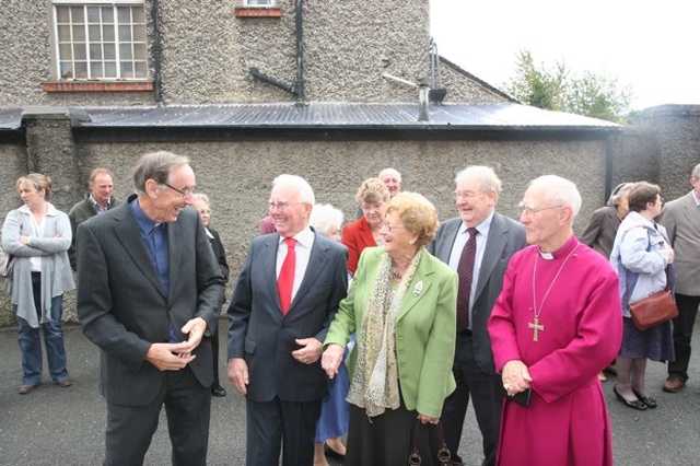 Pictured exchanging a few jokes at the blessing and re-dedication of Rathfarnham War Memorial Hall are (left to right) the Revd Harry Lew, Albert O'Keefe, Amy Gilbert (partially obscured) Winnie O'Keefe, Bob Gilbert and the former Bishop of Cork, the Rt Revd Roy Warke.