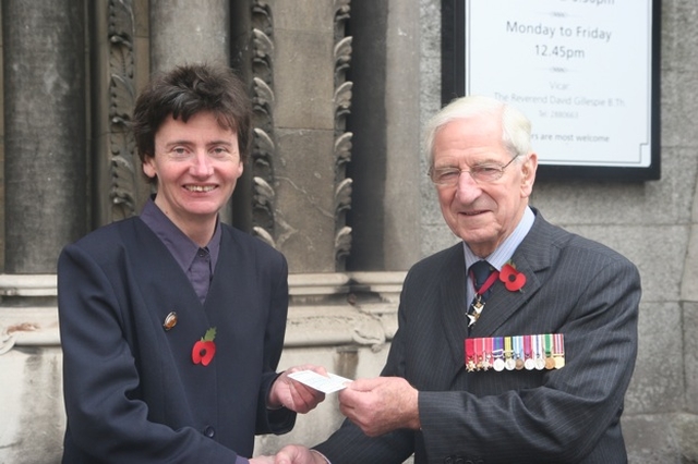 The Mayor of Mullingar Cllr Ruth Illingworth presents a cheque to The O'Morochu, President of the Royal British Legion (Republic of Ireland) following the Royal British Legion service of Remembrance in St Ann's Church, Dublin. The cheque was from the Mayor's allowance which Cllr Illingworth decided to donate to several charities.