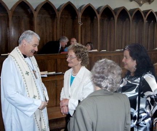 Archbishop Michael Jackson chats to parishioners in Glenealy following the Service of Thanksgiving for the restoration work carried out at the church. 