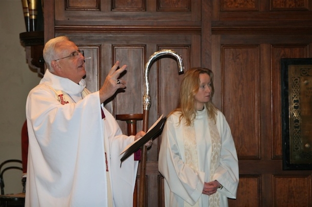 The Revd Sonia Gyles, Rector, is pictured beside Archbishop John Neill as he blesses the St Francis stained glass window in Sandford Parish Church. 