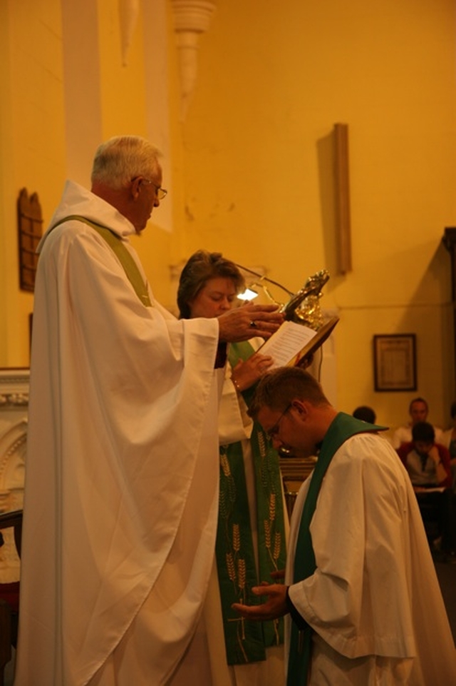 The Archbishop of Dublin, the Most Revd Dr John Neill blesses the Revd Rob Jones at his institution as Vicar of Rathmines and Harolds Cross.