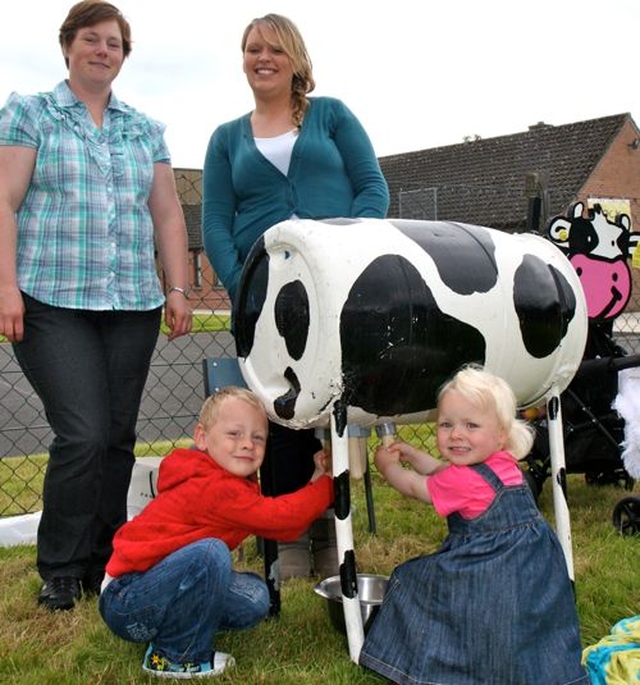 Andrew, Melanie and mum, Iris Hawkins with Donna Moody and Daisy the cow at Donoughmore Parish Fete. 