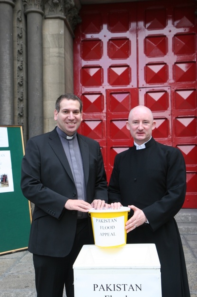 Pictured are the Revd Victor Fitzpatrick, Curate of St Ann's and St Stephens with Jon Scarffe conducting a sit out in aid of the Pakistan Flood appeal in front of St Ann's Church. 