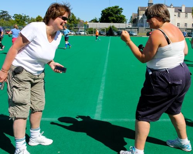 The organisers of the Diocesan Inter Parish Hockey Tournament, the Revd Anne Taylor and the Revd Gillian Wharton, go head to head on the sideline as their teams, Rathfarnham and Booterstown, Carysfort and Mount Merrion take each other on on the pitch. 