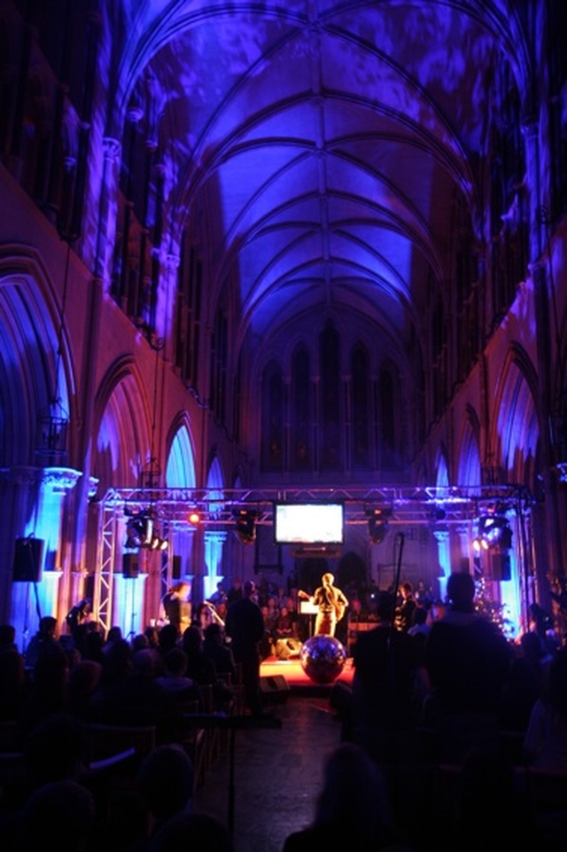 Some of the spectacular lighting at 3 Rock's Essential at Christ Church Carol Service for young people. On stage (back to camera) are the Rend Collective.