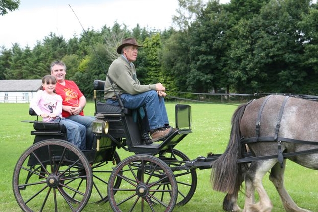 Trying out a more stately form of transport at a County Wicklow parish Fete and Raceday. 