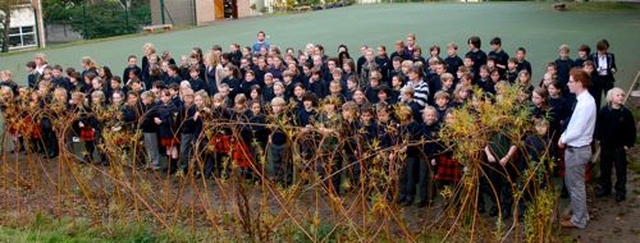 The senior pupils of Glenageary Killiney National School congregate to see Archbishop Michael Jackson dedicate and officially open their new outdoor classroom. 