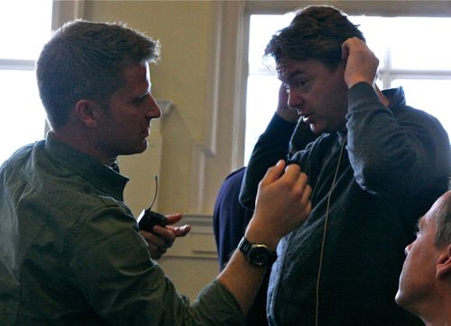 Greg Fromholz helps economist and author David McWilliams with his microphone before he speaks at the Rubicon conference which was organised by Holy Trinity Rathmines. 