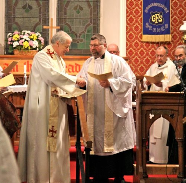 Archbishop Michael Jackson congratulates the Revd Neal O’Raw following his institution as the new Rector of Donoughmore and Donard with Dunlavin. 