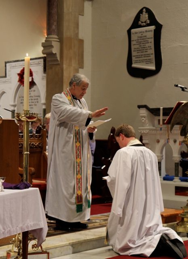 The Revd Bruce Hayes kneels before Archbishop Michael Jackson during the Service of Institution in St Patrick’s Church, Dalkey, on April 12. 