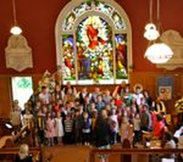 The pupils of Drumcondra National School sing their school hymn at the service in Drumcondra Parish Church to mark the reopening of the restored and extended building. 