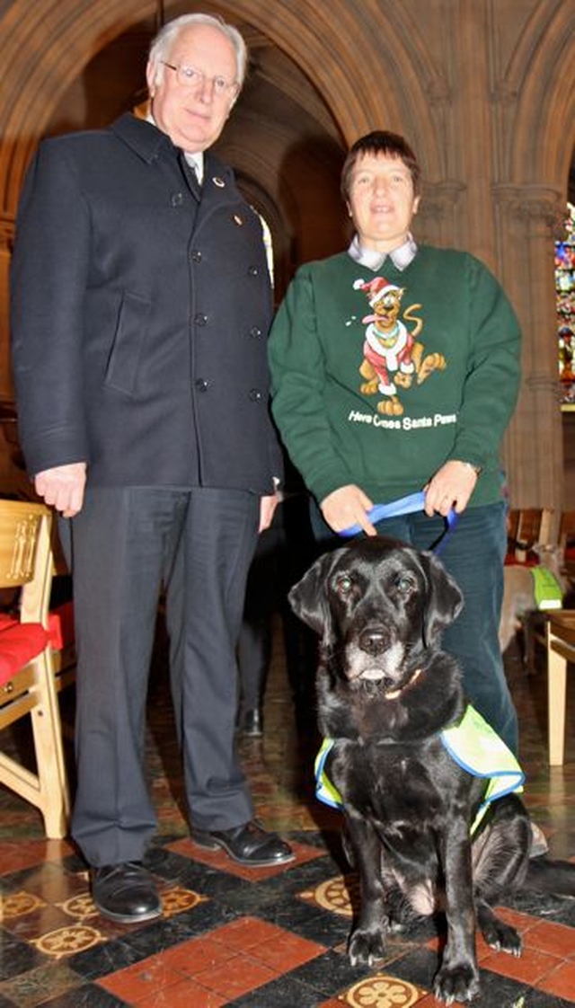 Berry is pictured with her owner Lesley Rue, who organises the annual Peata Carol Service in Christ Church Cathedral, and Brian Bradshaw who is a member of the cathedral Friends committee. 