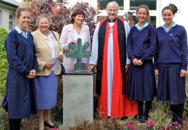 Rathdown School students, Kirsten Stravides, Rebecca Andrews and Clodagh Towns, join past principal Miss Stella Mews, current prinicipal Anne Dowling and Archbishop Michael Jackson following the unveiling of a sculpture to mark the school’s 40th anniversary. 