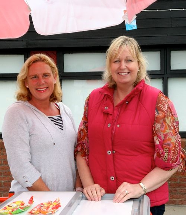 Rachel Beasley and Sinead Quinn had time on their hands as trade was slow on the ice cream stand at Wicklow Parish Fete due to cool weather. 