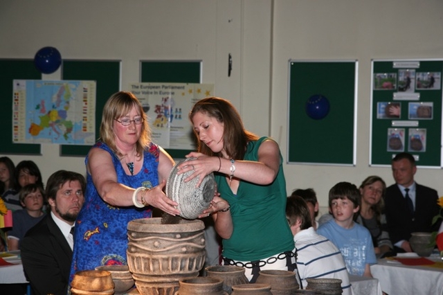 Filling the urn with soil from students of a south Dublin school. The soil was used to plant a Yew tree to celebrate community spirit and unity within Europe.